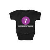 Baby Classic Subway Logo Romper | Black romper with a blue circle featuring a white "7". Text below reads: "Manhattan to Queens." Perfect for fans of the NYC Subway Line.