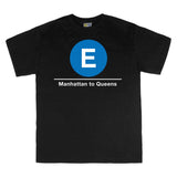 Classic Subway Tees | Black t-shirt with a blue circle featuring a white "E". Text below reads: "Manhattan to Queens." Perfect for fans of the NYC Subway Line.