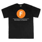 Classic Subway Tees | Black t-shirt with a blue circle featuring a white "F". Text below reads: "Brooklyn to Queens." Perfect for fans of the NYC Subway Line.